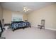 Bedroom with a double bed, a ceiling fan, carpet and a large window at 204 Pinehurst Way, Carrollton, GA 30116