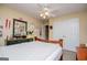 Bedroom featuring a double bed, light yellow walls, carpet, and large closet doors at 204 Pinehurst Way, Carrollton, GA 30116