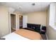 Bright bedroom with neutral paint, a dark dresser, and plush carpeting at 204 Pinehurst Way, Carrollton, GA 30116