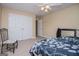 Bedroom with a double bed, a ceiling fan, carpet, a chair, and a large closet at 204 Pinehurst Way, Carrollton, GA 30116