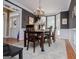 Elegant dining room with a bay window, chandelier, and wainscoting, perfect for entertaining guests at 204 Pinehurst Way, Carrollton, GA 30116