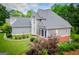 Stunning view of the home's exterior with lush foliage and a well-maintained lawn at 204 Pinehurst Way, Carrollton, GA 30116