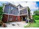 This home's exterior has a porch and a patio for outdoor living and entertaining at 204 Pinehurst Way, Carrollton, GA 30116