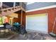 Backyard patio features a two car garage attached to the main house with a staircase to the deck above at 204 Pinehurst Way, Carrollton, GA 30116