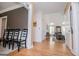 Inviting hallway with hardwood floors leading to the living room, showcasing natural light and spaciousness at 204 Pinehurst Way, Carrollton, GA 30116
