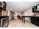 Spacious basement kitchen and dining area featuring modern stainless steel appliances and hardwood flooring at 204 Pinehurst Way, Carrollton, GA 30116