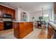 Bright kitchen features a kitchen island, wood cabinets and stainless steel appliances at 204 Pinehurst Way, Carrollton, GA 30116