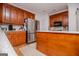 Spacious kitchen with wood cabinets, stainless steel refrigerator, and center island at 204 Pinehurst Way, Carrollton, GA 30116