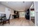 Open kitchen with sleek black cabinetry, stainless appliances, and an adjacent dining area at 204 Pinehurst Way, Carrollton, GA 30116