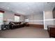 Basement living room with carpeting, traditional furniture and decor, and recessed lighting at 204 Pinehurst Way, Carrollton, GA 30116