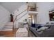 Bright living room with soaring ceilings, staircase, and an abundance of natural light at 204 Pinehurst Way, Carrollton, GA 30116