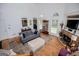 Bright living room features high ceilings, a fireplace, and is filled with natural light at 204 Pinehurst Way, Carrollton, GA 30116