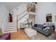 Bright living room boasts soaring ceilings, staircase, and lots of natural light at 204 Pinehurst Way, Carrollton, GA 30116