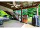 Covered patio offers an outdoor kitchen and a staircase to the second floor at 204 Pinehurst Way, Carrollton, GA 30116