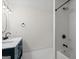 Bright bathroom with double vanity, modern fixtures, and tub with tiled shower at 500 Happy Hollow Rd, Villa Rica, GA 30180