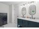 Bright bathroom with double vanity, modern fixtures, and white tiled floors at 500 Happy Hollow Rd, Villa Rica, GA 30180