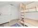 This bedroom features a set of bunk beds, a white dresser, and neutral paint at 500 Happy Hollow Rd, Villa Rica, GA 30180