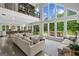 Bright, open-concept living room with large windows, lofted library, and modern furnishings flowing into kitchen at 500 Happy Hollow Rd, Villa Rica, GA 30180