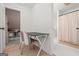 Small study area featuring a desk, chair, and views into bedroom and bathroom at 500 Happy Hollow Rd, Villa Rica, GA 30180