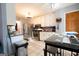Functional kitchen with stainless steel appliances, white cabinets, and bright tile flooring at 1858 Mcconnell Rd, Grayson, GA 30017