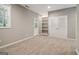 Finished basement offering ample space, built-in shelves, and an exterior door at 56 American Walk, Peachtree City, GA 30269