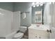 Bright bathroom with a shower-tub combination, white vanity, and updated fixtures at 56 American Walk, Peachtree City, GA 30269