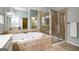 Spacious bathroom featuring a soaking tub, glass shower, and tile floors at 56 American Walk, Peachtree City, GA 30269