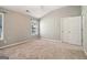 Neutral bedroom offering dual window views, carpet, and white doors at 56 American Walk, Peachtree City, GA 30269
