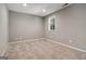 Neutral bedroom with plush carpet and a bright window at 56 American Walk, Peachtree City, GA 30269