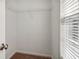 Walk-in closet featuring wire shelving for storage, window and carpeted flooring at 56 American Walk, Peachtree City, GA 30269