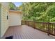 Wood deck offers serene outdoor living space with private treed surroundings at 56 American Walk, Peachtree City, GA 30269