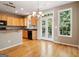 Inviting kitchen with hardwood floors, wood cabinets, and access to the outdoors at 56 American Walk, Peachtree City, GA 30269