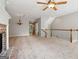 Expansive living room with brick fireplace, open staircase, and neutral decor at 56 American Walk, Peachtree City, GA 30269