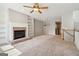 Comfortable living room with fireplace, built-in shelves, and abundant natural light at 56 American Walk, Peachtree City, GA 30269