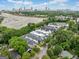 Aerial view of modern townhomes with the city skyline visible in the distance at 32 Walthall Ne St # A, Atlanta, GA 30307