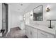 Bright bathroom with double vanity, modern mirrors, stylish sconces, and tiled shower at 32 Walthall Ne St # A, Atlanta, GA 30307