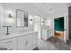 Bathroom featuring double vanity, contemporary mirrors, sleek lighting, and tiled flooring at 32 Walthall Ne St # A, Atlanta, GA 30307