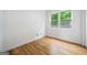 Bright bedroom featuring hardwood floors, a neutral color scheme, and a window providing natural light at 32 Walthall Ne St # A, Atlanta, GA 30307