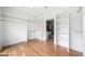 Walk-in closet featuring built-in shelving and hanging rods adjacent to bathroom at 32 Walthall Ne St # A, Atlanta, GA 30307