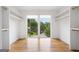 Walk-in closet featuring built-in shelving, hanging rods and expansive exterior view at 32 Walthall Ne St # A, Atlanta, GA 30307