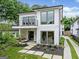 Modern two-story home showcasing a balcony, front porch, landscaped yard, and inviting curb appeal at 32 Walthall Ne St # A, Atlanta, GA 30307