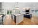 Open-concept kitchen flowing into the living room with a fireplace and comfortable seating area at 32 Walthall Ne St # A, Atlanta, GA 30307