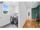 Laundry room featuring modern washer and dryer, and hexagon tile floors at 32 Walthall Ne St # A, Atlanta, GA 30307