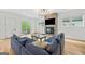 Cozy living room showcasing hardwood floors, fireplace, and sliding glass doors to outdoor living at 32 Walthall Ne St # A, Atlanta, GA 30307