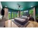 Comfortable main bedroom featuring hardwood floors, an outdoor balcony, and recessed lighting at 32 Walthall Ne St # A, Atlanta, GA 30307