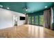 Main bedroom featuring an attached bathroom, a walk-out balcony, hardwood floors, and recessed lighting at 32 Walthall Ne St # A, Atlanta, GA 30307