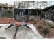 Modern backyard patio with designer fire pit, covered porch, and freshly landscaped yard at 3229 Kingsdale Dr # 2, Atlanta, GA 30311