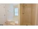 Bathroom with combined bathtub shower with natural light at 5502 Sapphire Cir, Ellenwood, GA 30294
