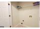 Laundry room featuring plumbing hookups, shelving and a door for privacy at 5502 Sapphire Cir, Ellenwood, GA 30294
