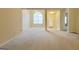 Large living room with arched windows and tiled floors, perfect for entertaining at 5502 Sapphire Cir, Ellenwood, GA 30294